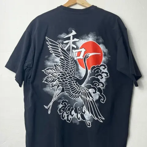 a custom screen print on a black t shirt of a chinese-style dragon