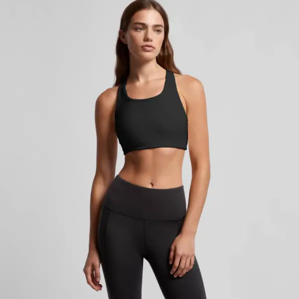 Black athletic crop top with modern square neckline paired with high-waisted compression leggings.