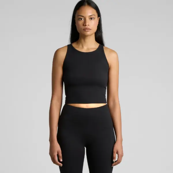 Woman wearing black workout crop tank top and high-waisted leggings, front view athletic set against neutral backdrop