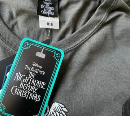 a charcoal t-shirt branded with a Disney's 'A Nightmare Before Christmas' printed design, licensed swing tag and neck label.