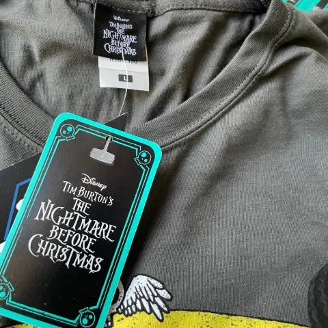 a charcoal t-shirt branded with a Disney's 'A Nightmare Before Christmas' printed design, licensed swing tag and neck label.
