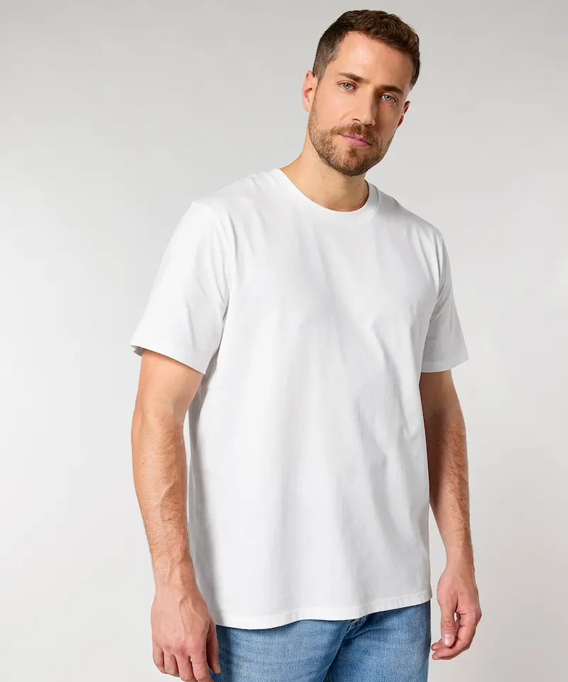 model wearing a white stanley stella creator 2.0 tee and blue jeans