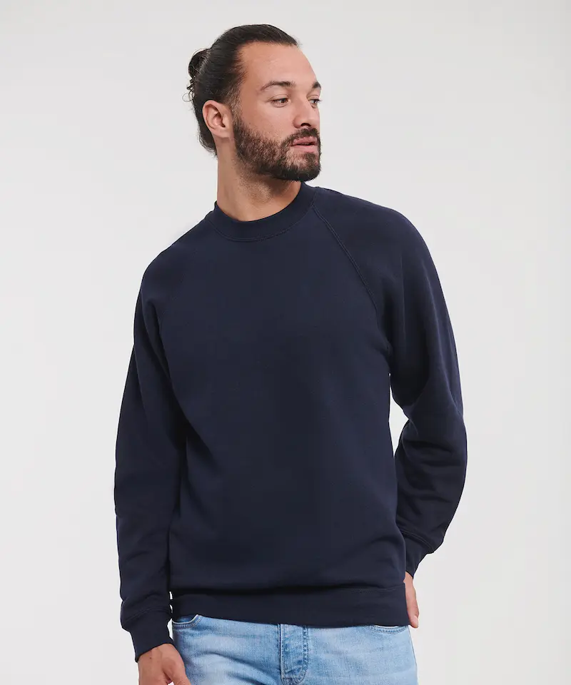 model wearing a navy russell classic sweatshirt